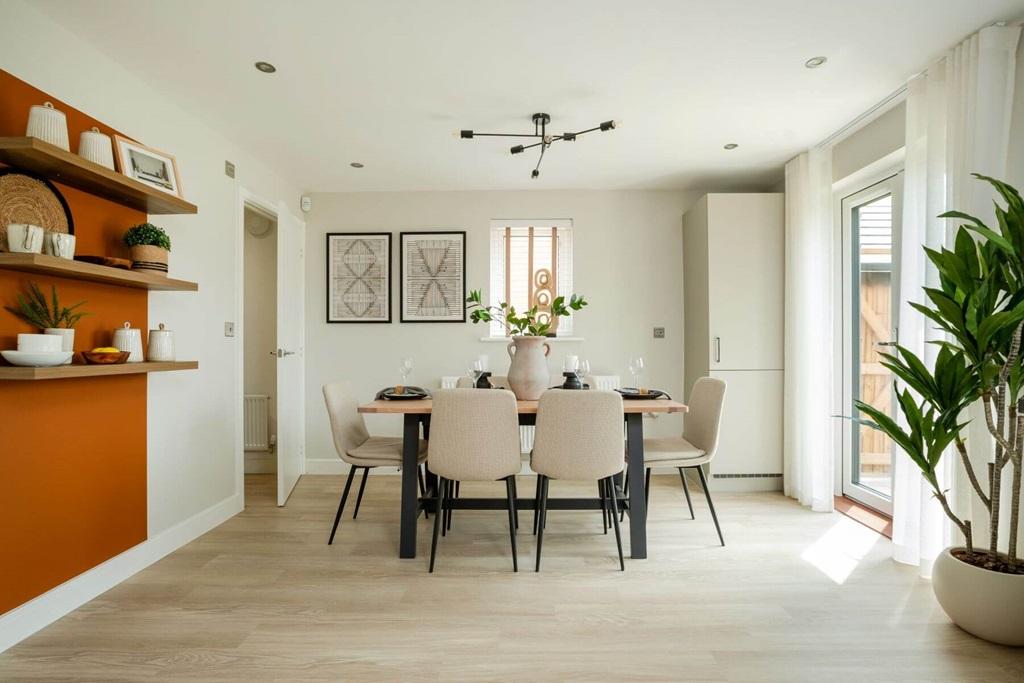 The kitchen/dining area boasts double doors out...