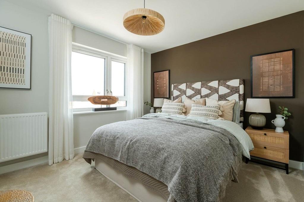 The main bedroom features a luxury en suite...