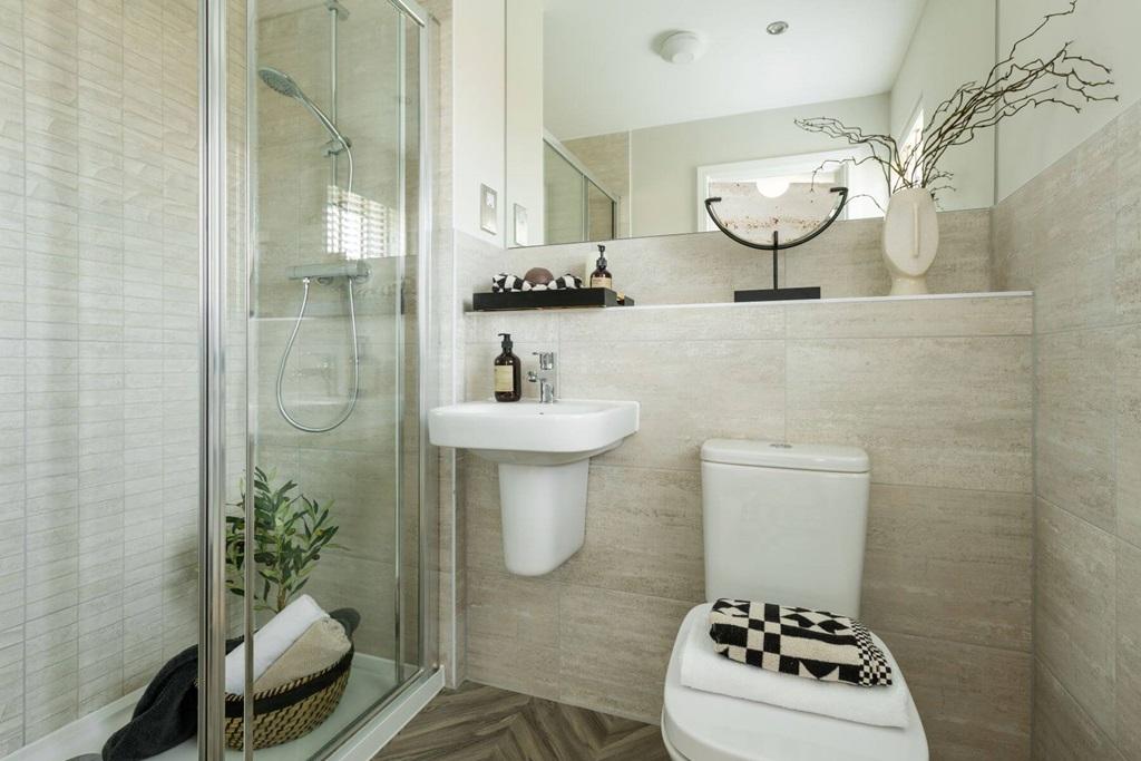 The en suite features high quality fixtures and...