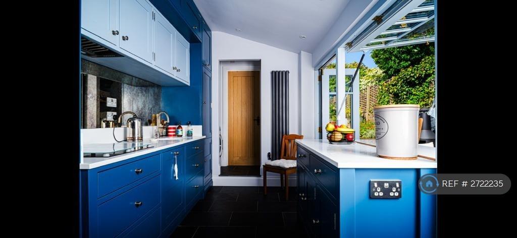 Kitchen Looking To The Utility And Bathroom Door.