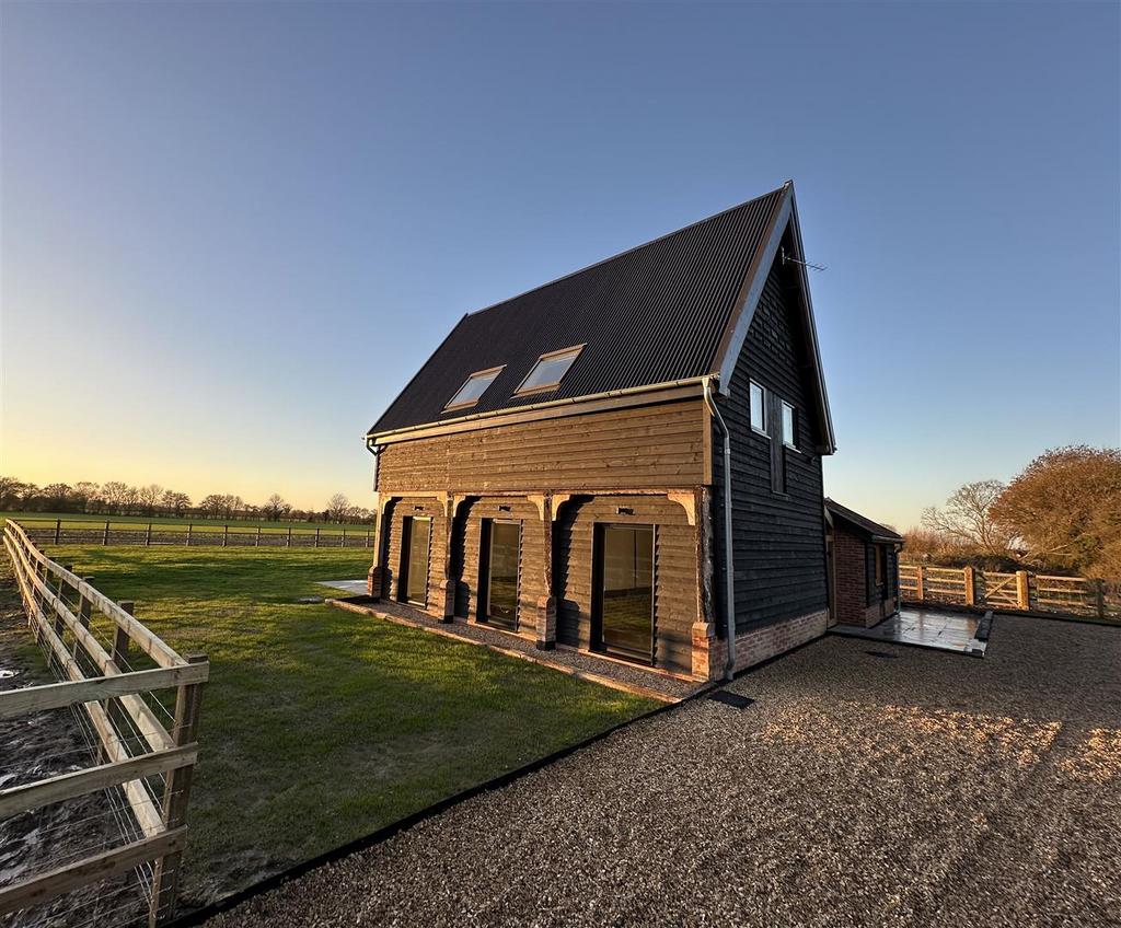 Granary exterior with fence.jpg