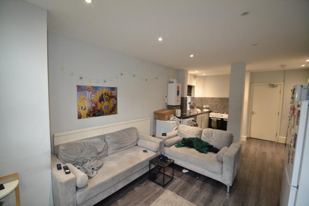 This spacious living room features cozy seating...