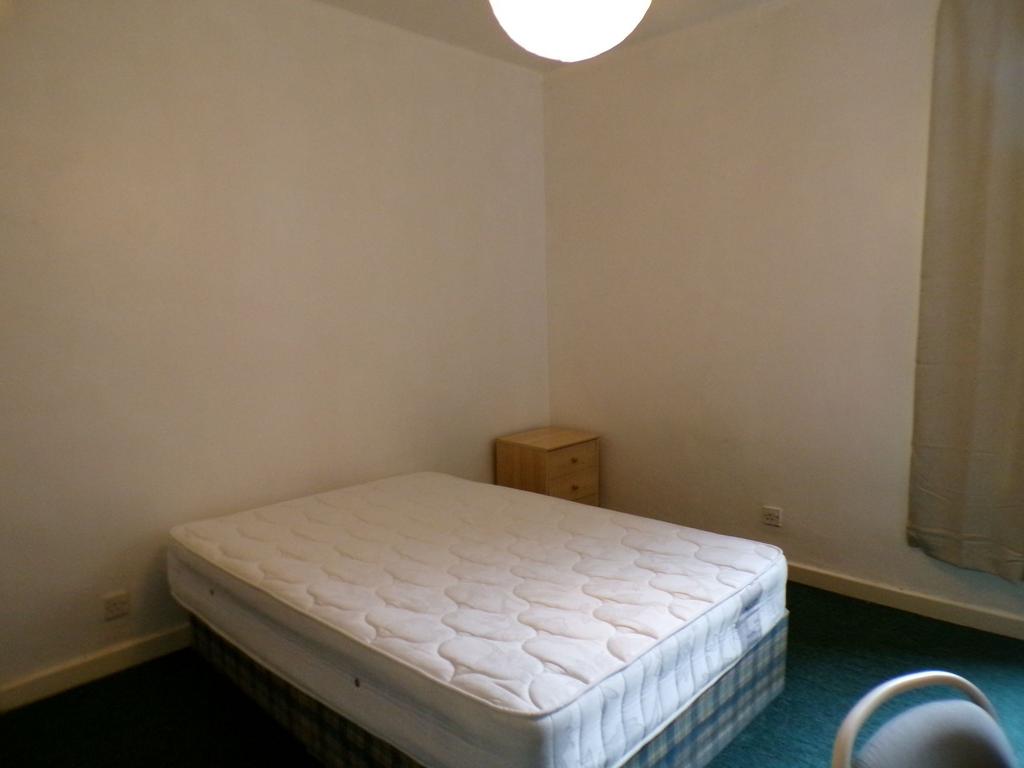 Simple furnished bedroom with a double mattress...