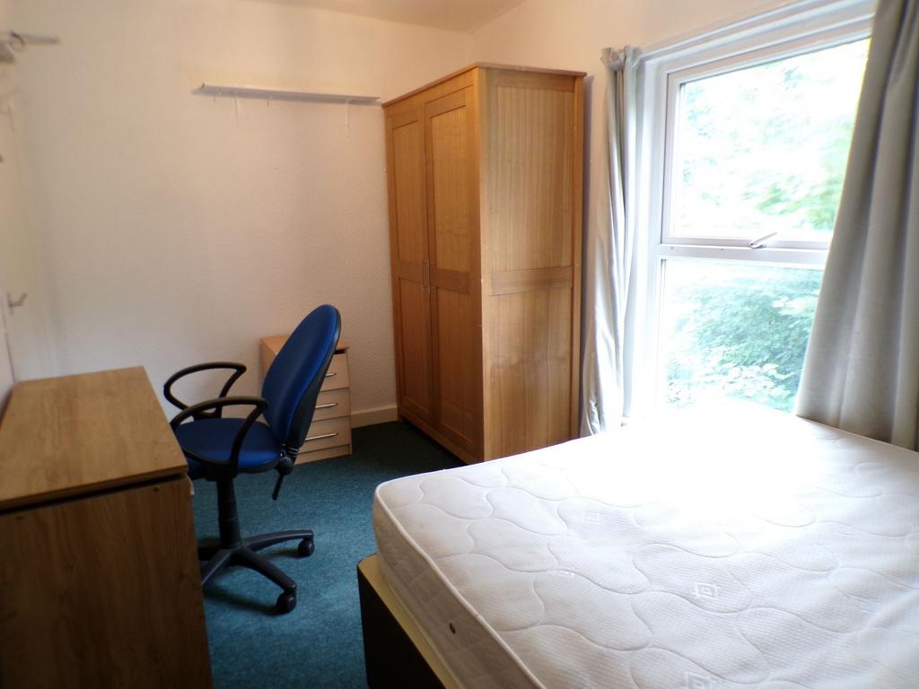 Bright bedroom with a large window bringing in ...