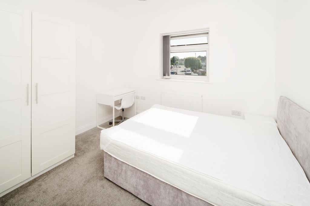 Bright, freshly decorated double bedroom with a...