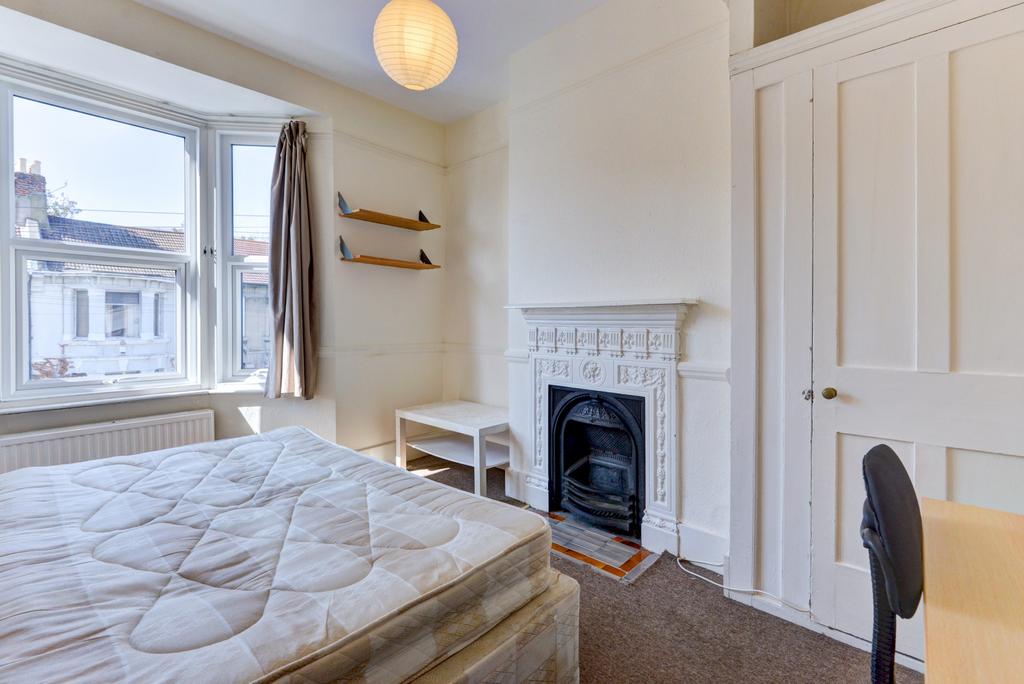 Bright, well-presented bedroom with a large sas...