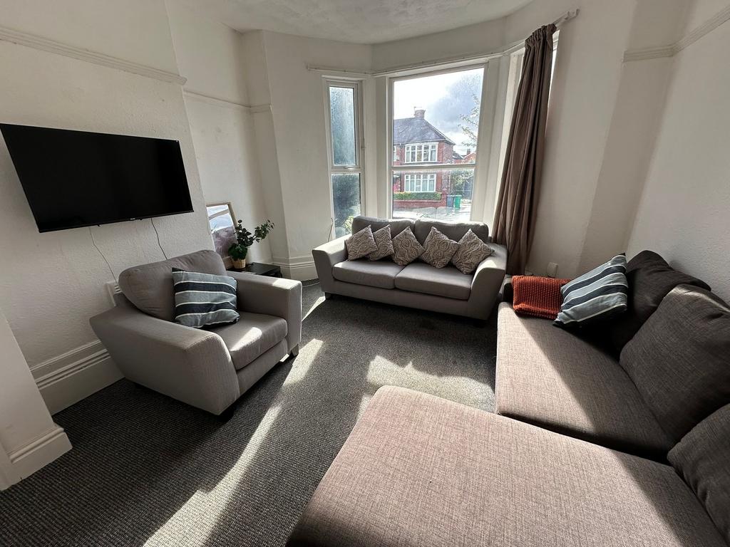 Bright and inviting living room featuring multi...