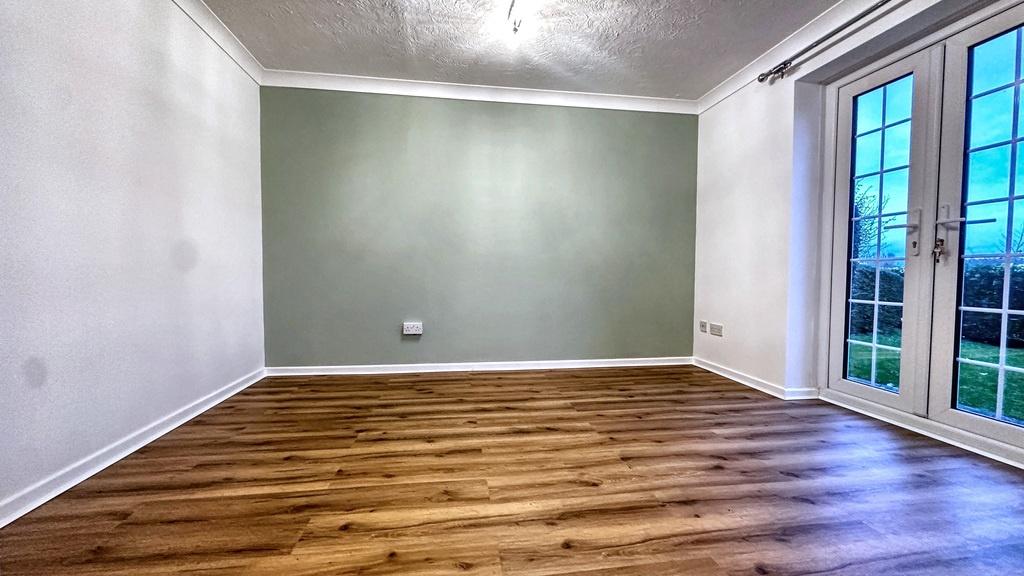 Bright, modern living room with wooden floors, ...