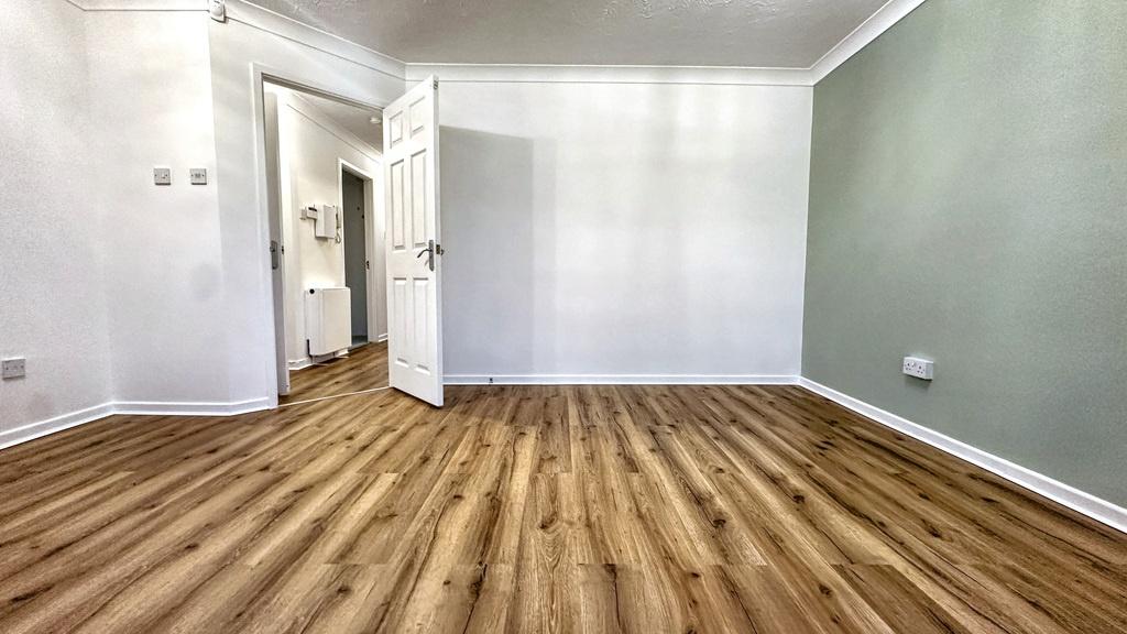 Bright, freshly decorated living room with new ...