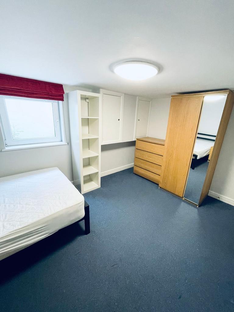 Bright, neatly presented bedroom with fitted st...