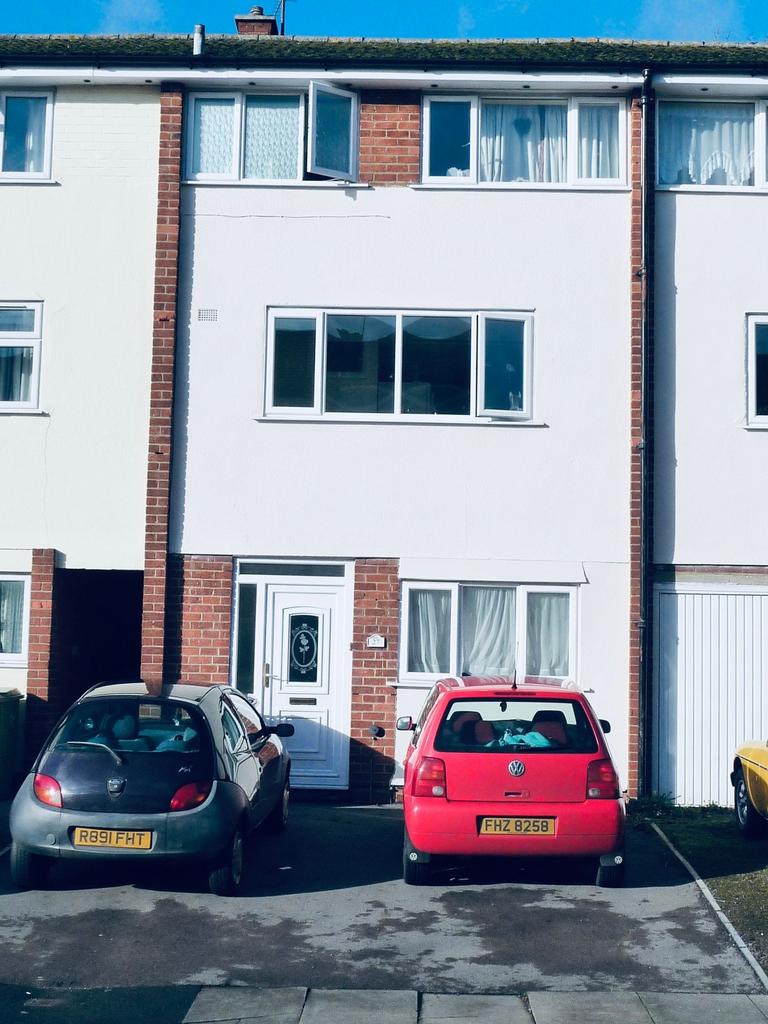 Terraced three-storey house with a fresh white ...