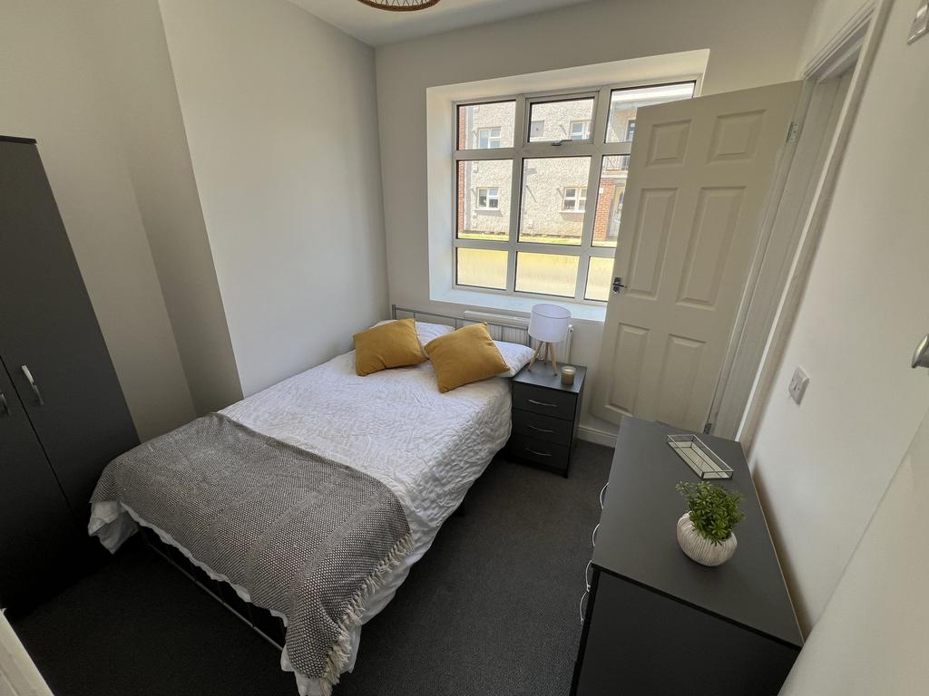 Bright, well-presented bedroom with a large fro...