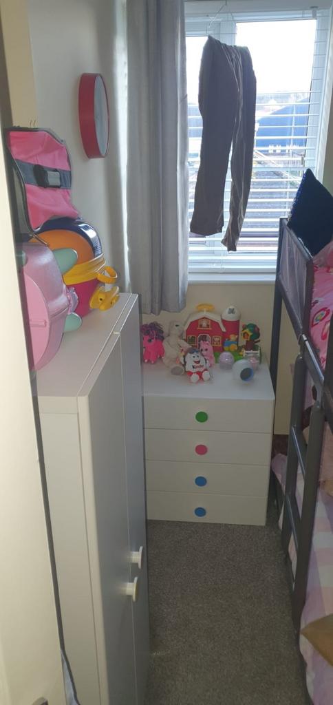 Compact, tidy bedroom with bunk bed and cheerfu...