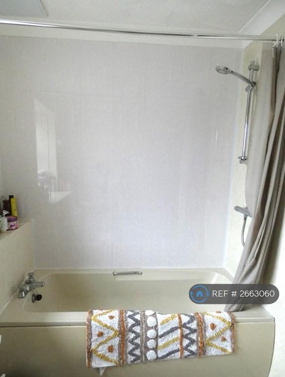 Bathroom With Separate Shower Unit Over Bath