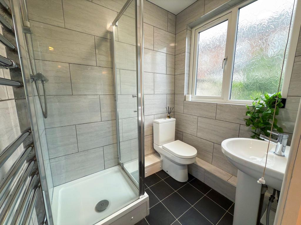 Bright, modern bathroom with a walk-in shower, ...