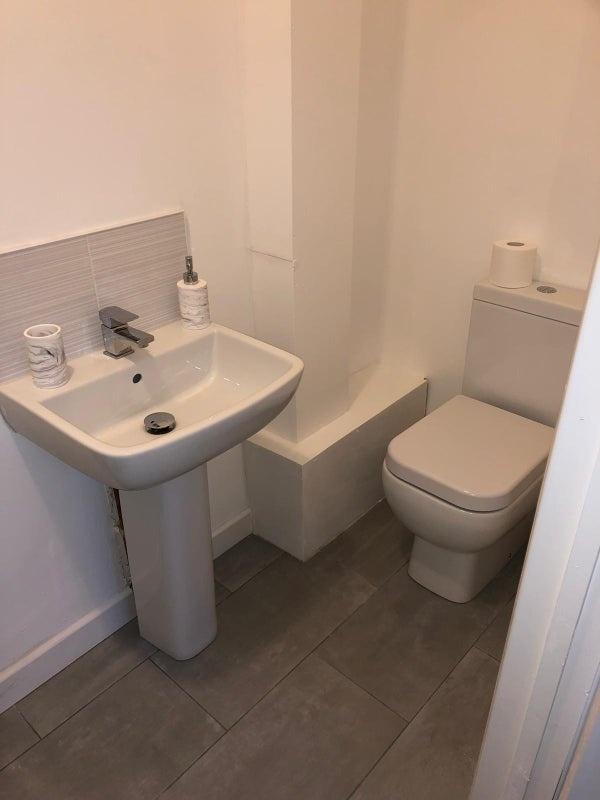 Fresh, modern bathroom with a contemporary pede...