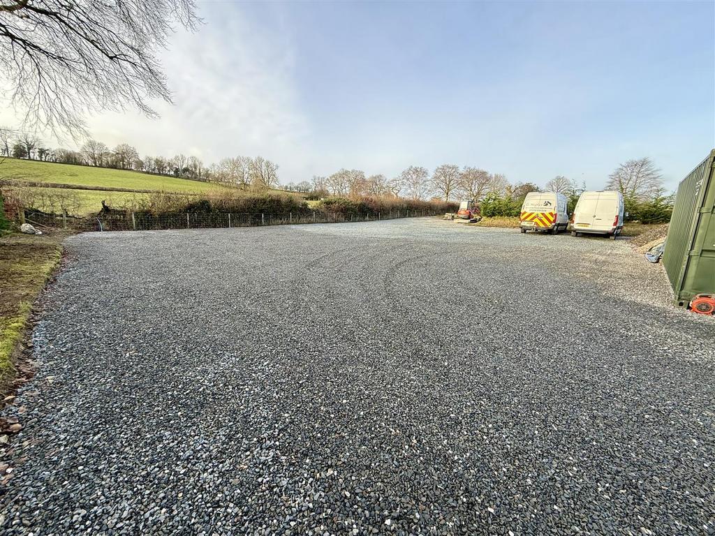 Extensive and secure gravelled parking area