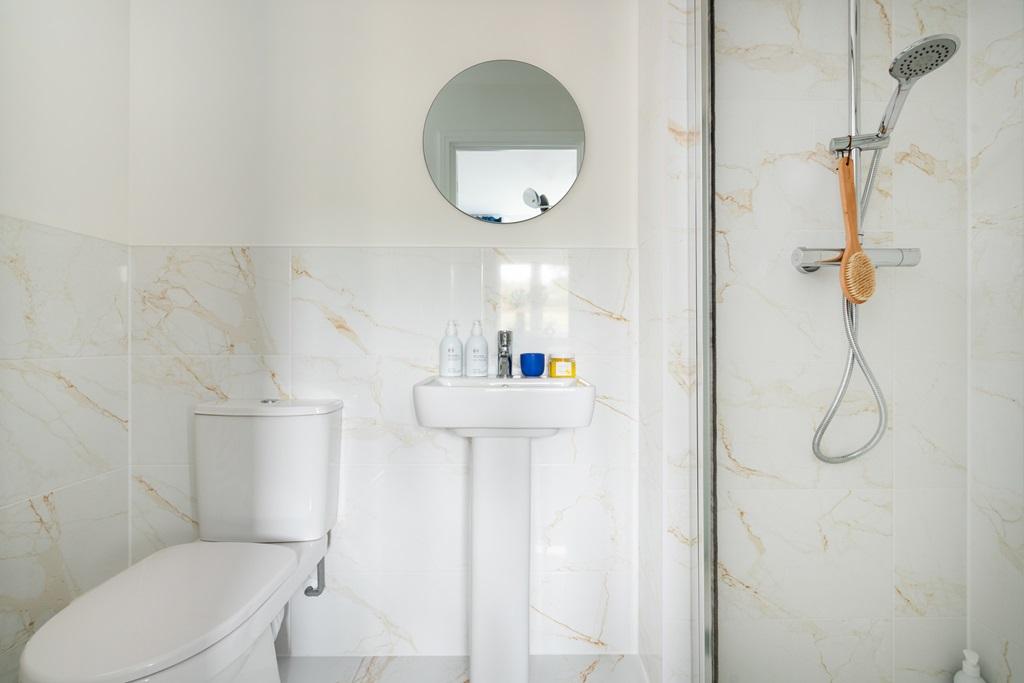 The main bedroom also benefits from it's own en...