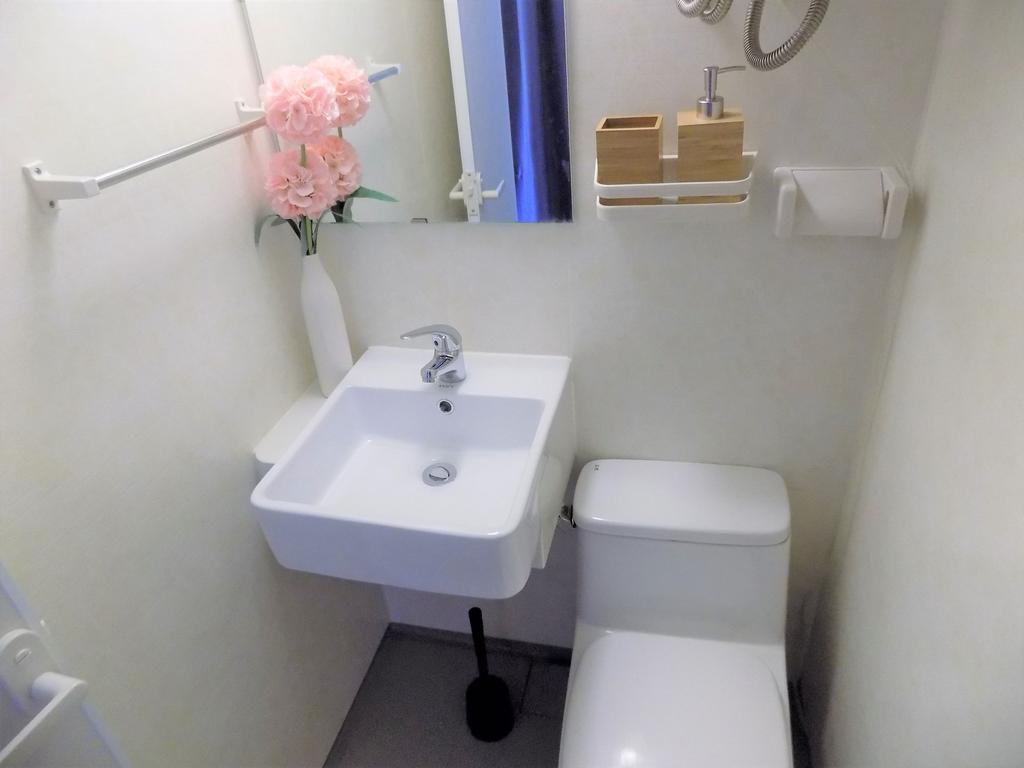 Compact, well-kept bathroom with a modern squar...