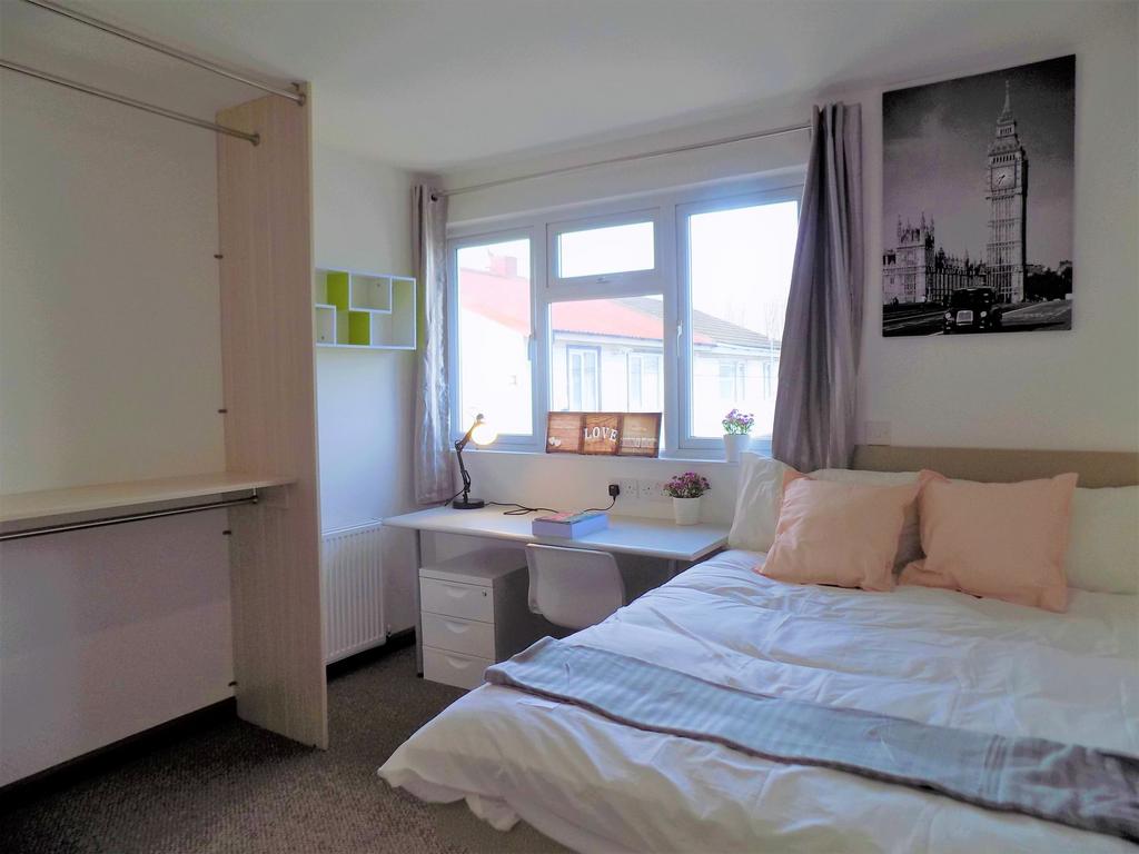 Bright, neatly presented bedroom with a double ...