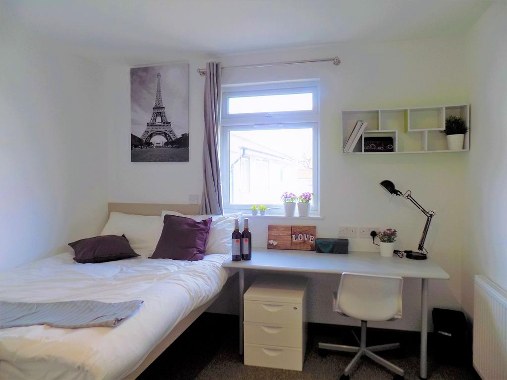 Bright, tidy bedroom with a comfortable bed, bu...