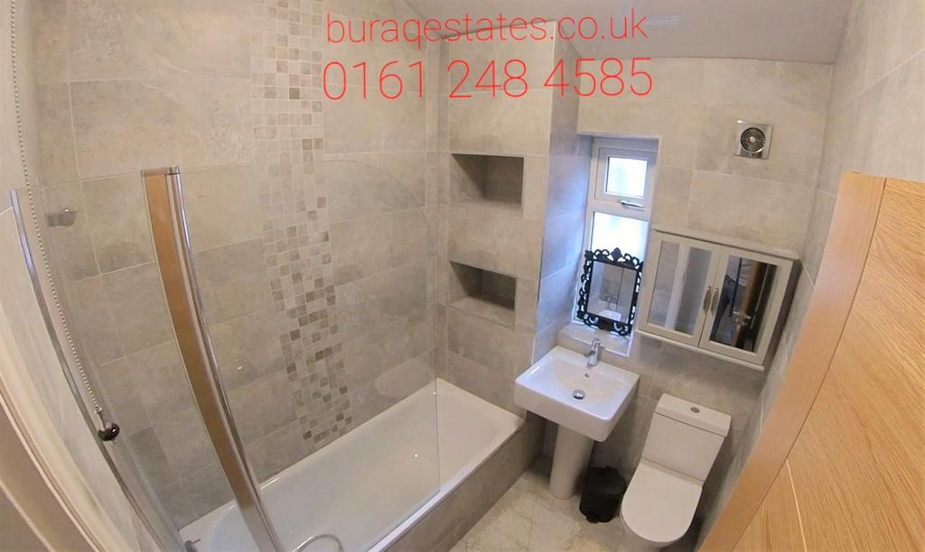Modern bathroom with a bath and shower screen, ...