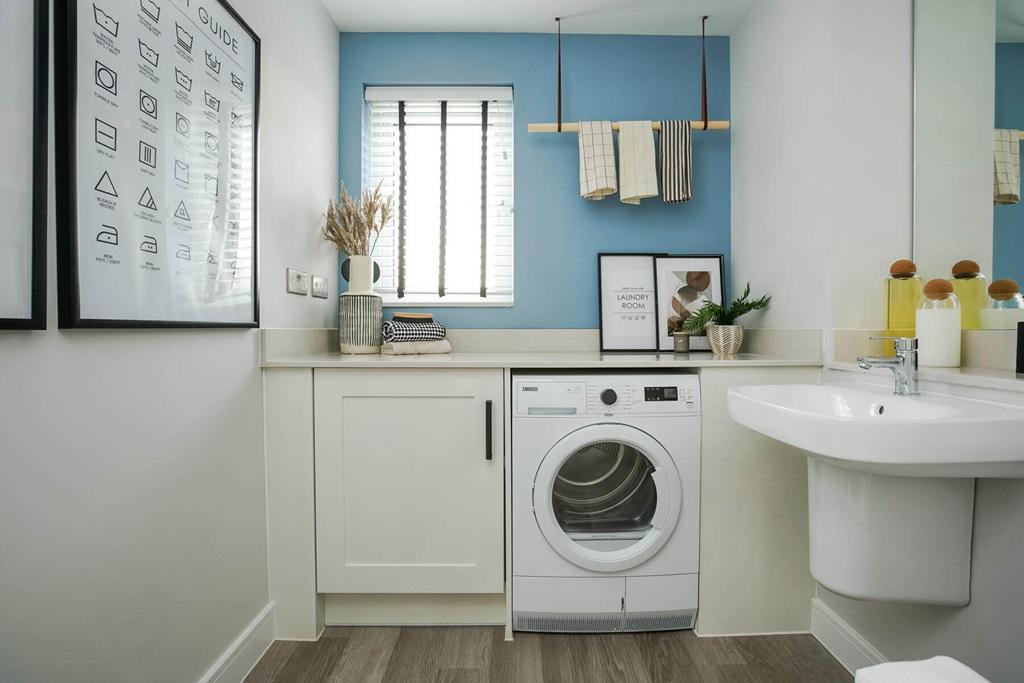 A guest cloakroom hosts space for laundry...
