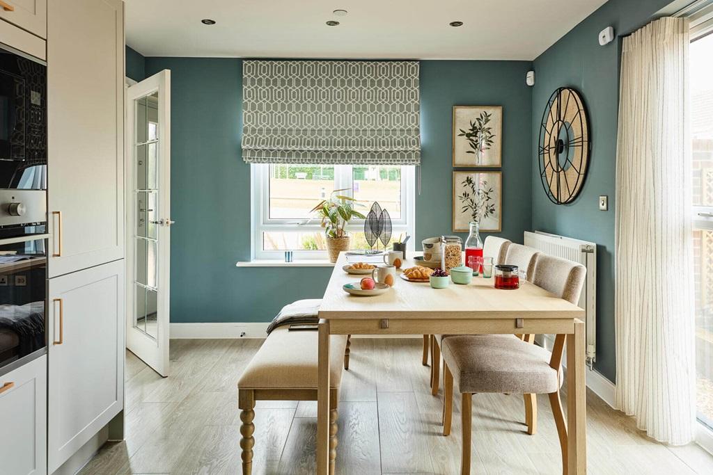 The dining area leads through double doors to...