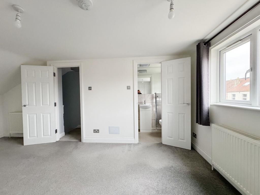 Bright, recently redecorated master bedroom wit...