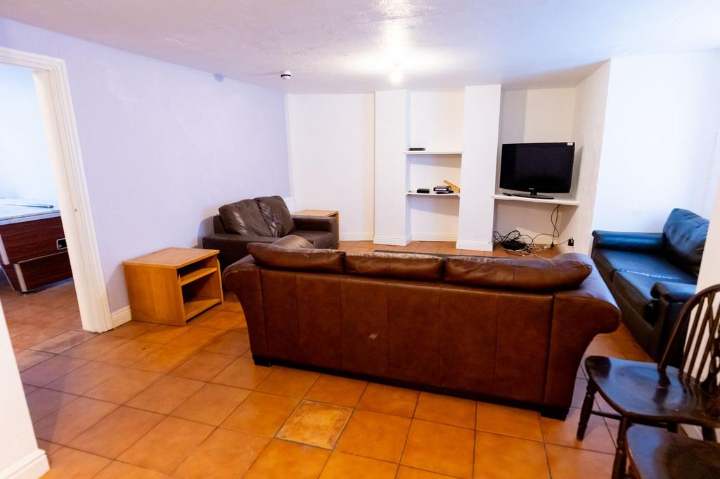 Spacious living room featuring comfortable sofa...