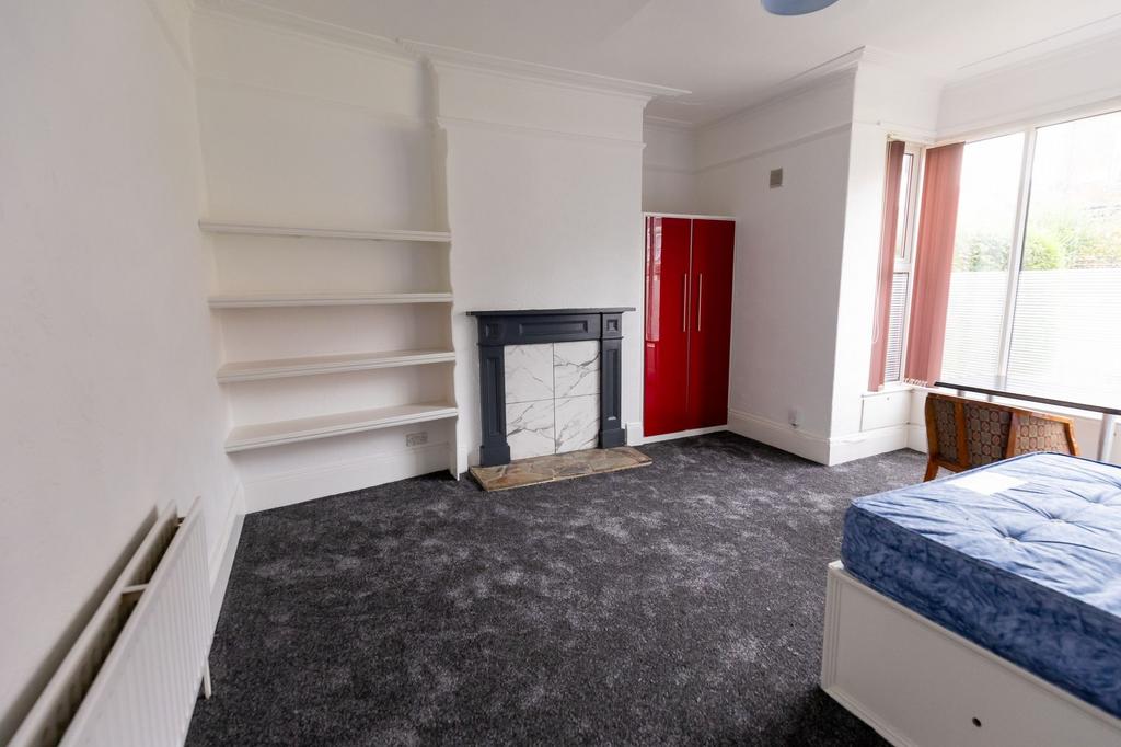 Bright and airy living room featuring a large w...