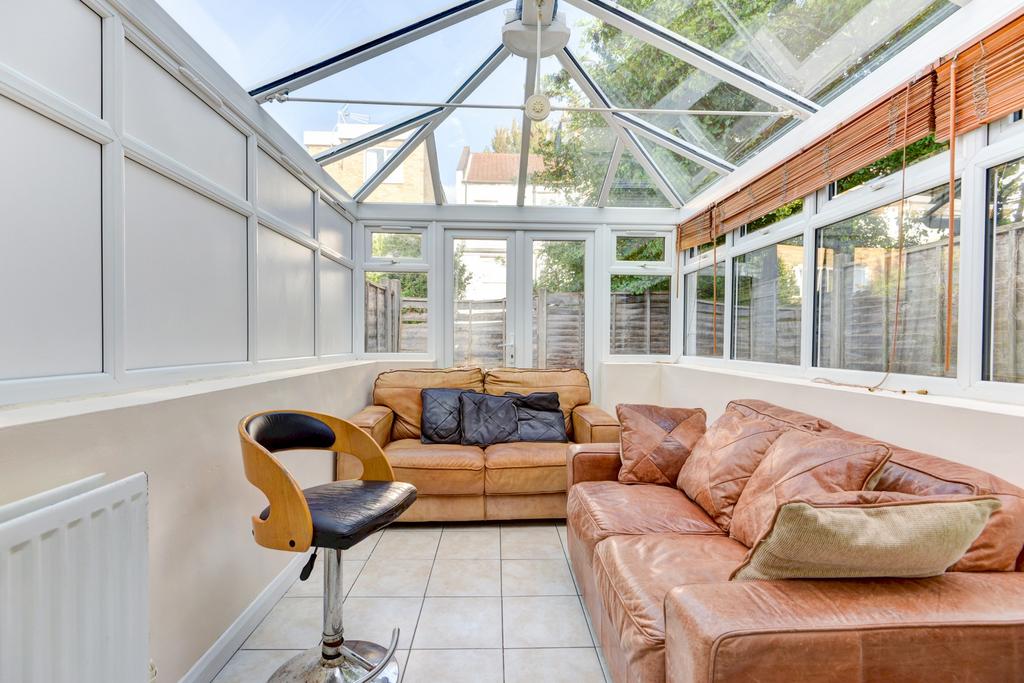 Bright conservatory-style communal lounge with ...
