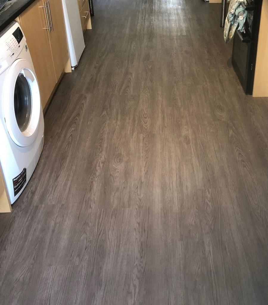 Long galley-style kitchen corridor with modern ...