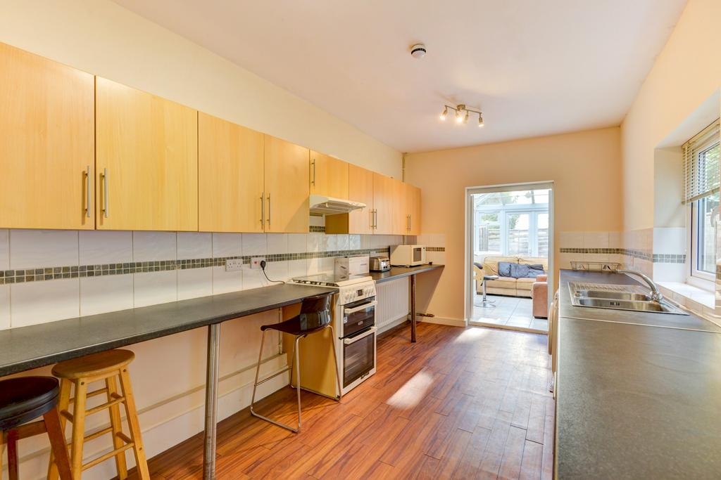 Bright galley kitchen with plentiful counter sp...