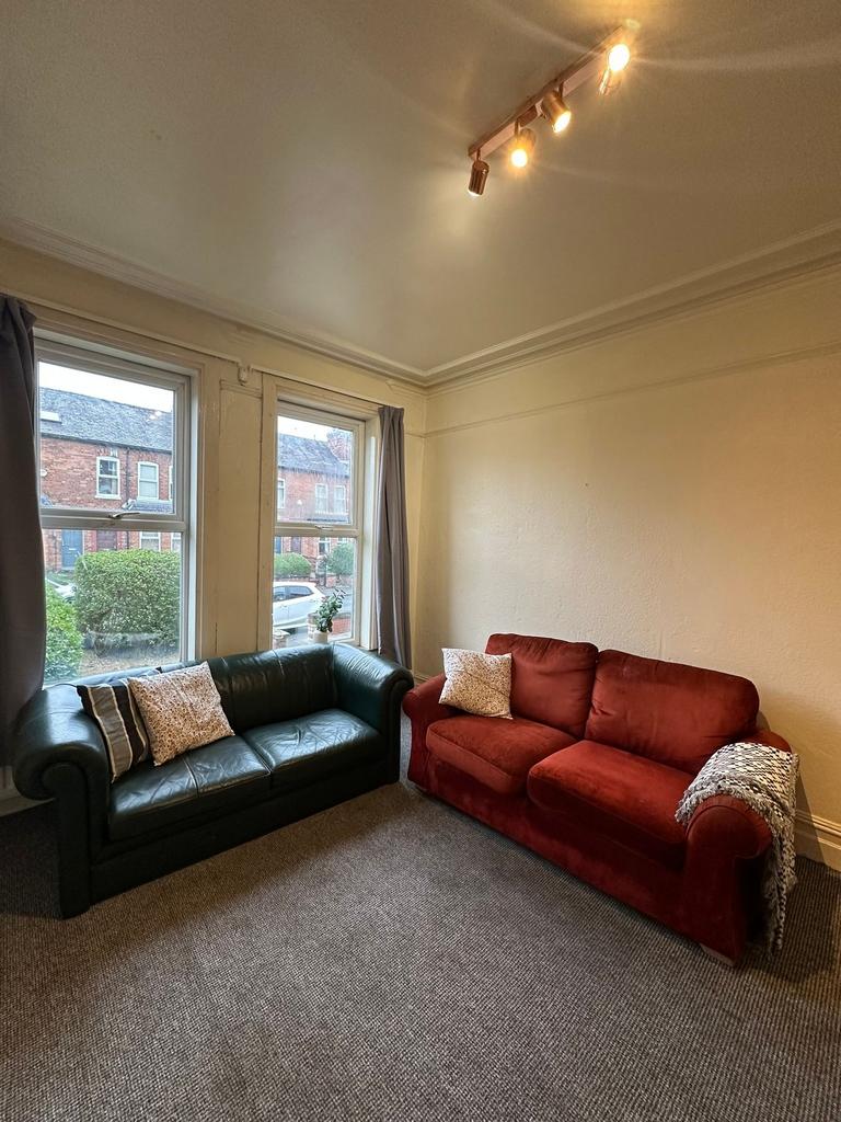 A cozy living room with two comfortable sofas, ...
