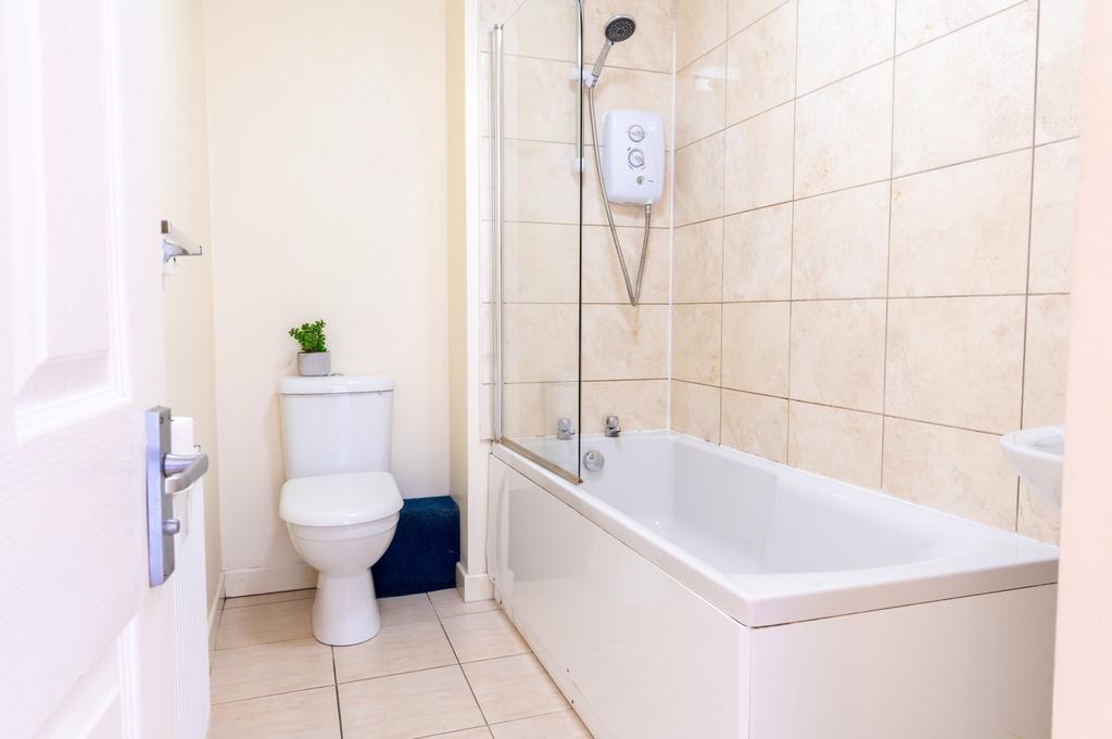 Bright and modern bathroom featuring a stylish ...