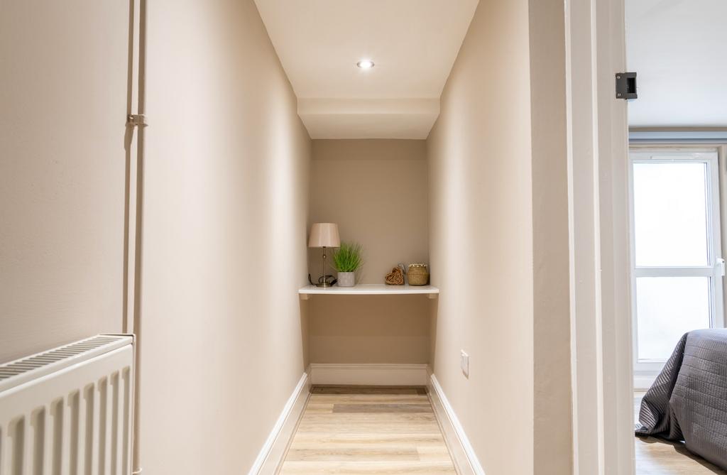 A well-maintained hallway featuring modern deco...