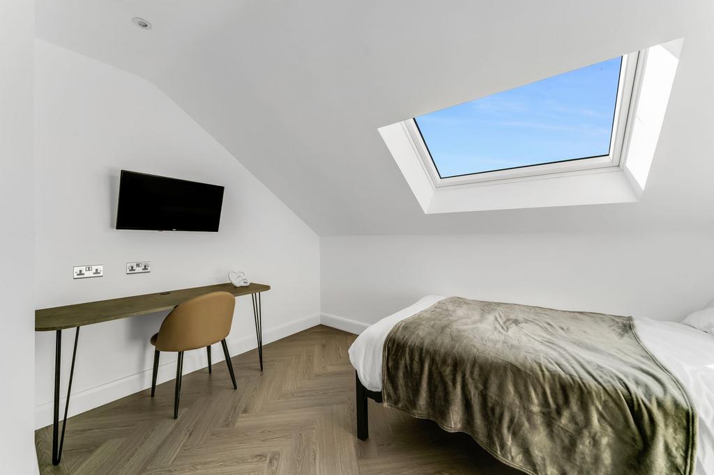 Bright and modern bedroom featuring a spacious ...