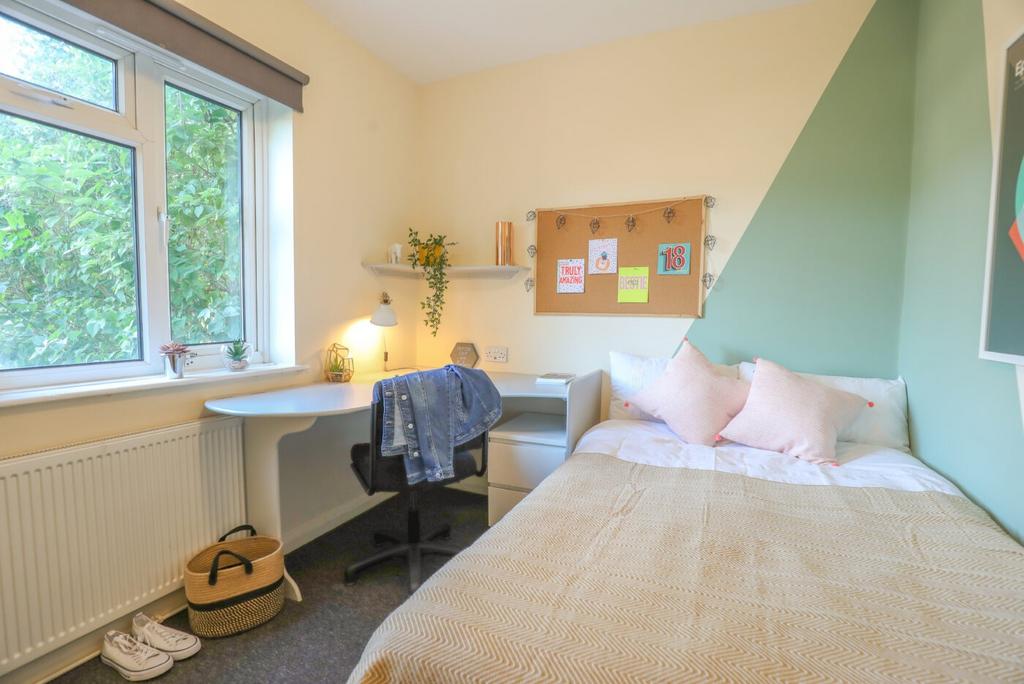 Bright and inviting bedroom with ample natural ...