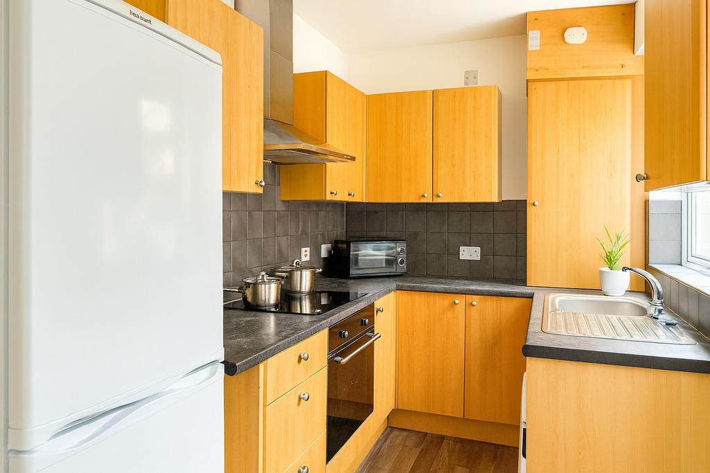 A bright and well-maintained kitchen featuring ...