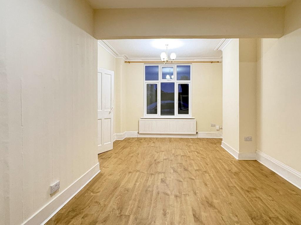 Bright, freshly redecorated living room with cl...