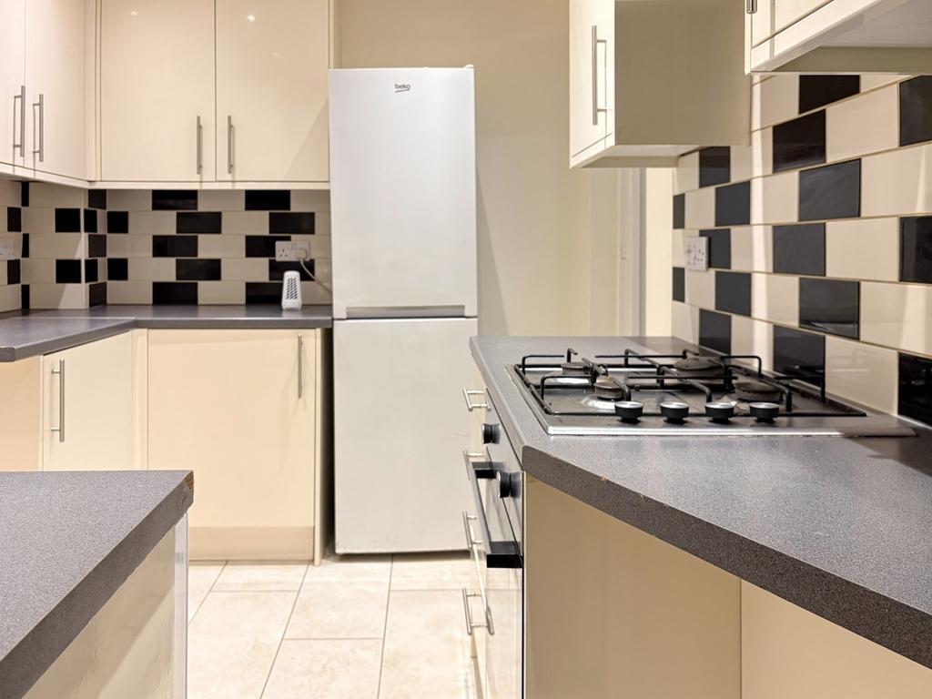 Modern galley kitchen with contrasting black-an...