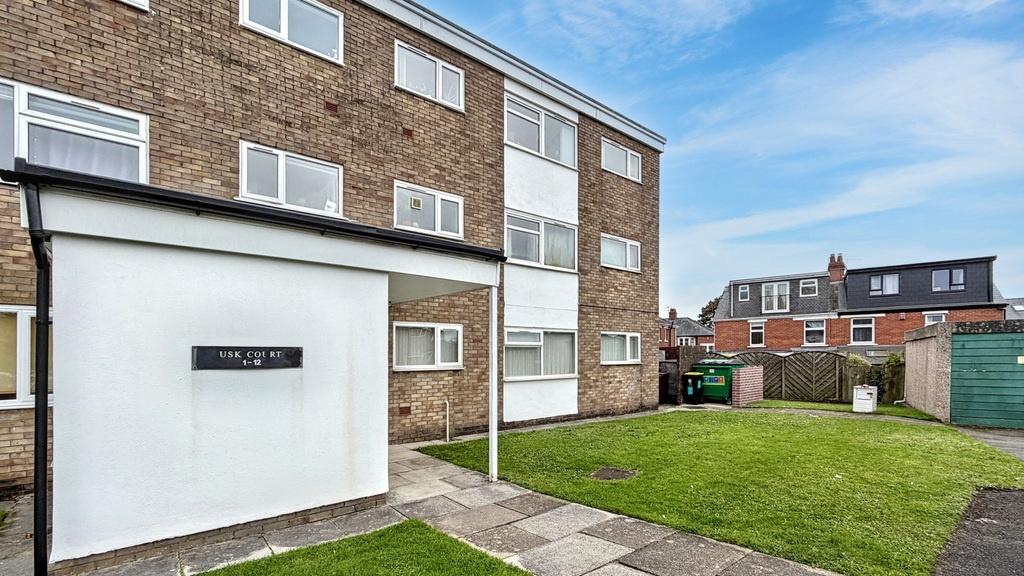 Well-maintained exterior of a brick-built resid...