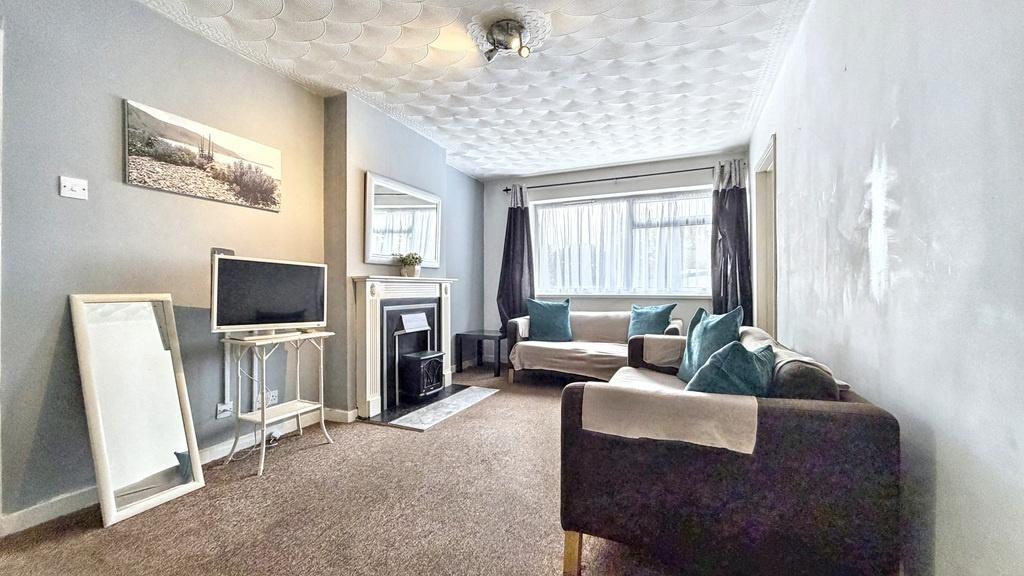 Bright, modern living room with a comfortable s...