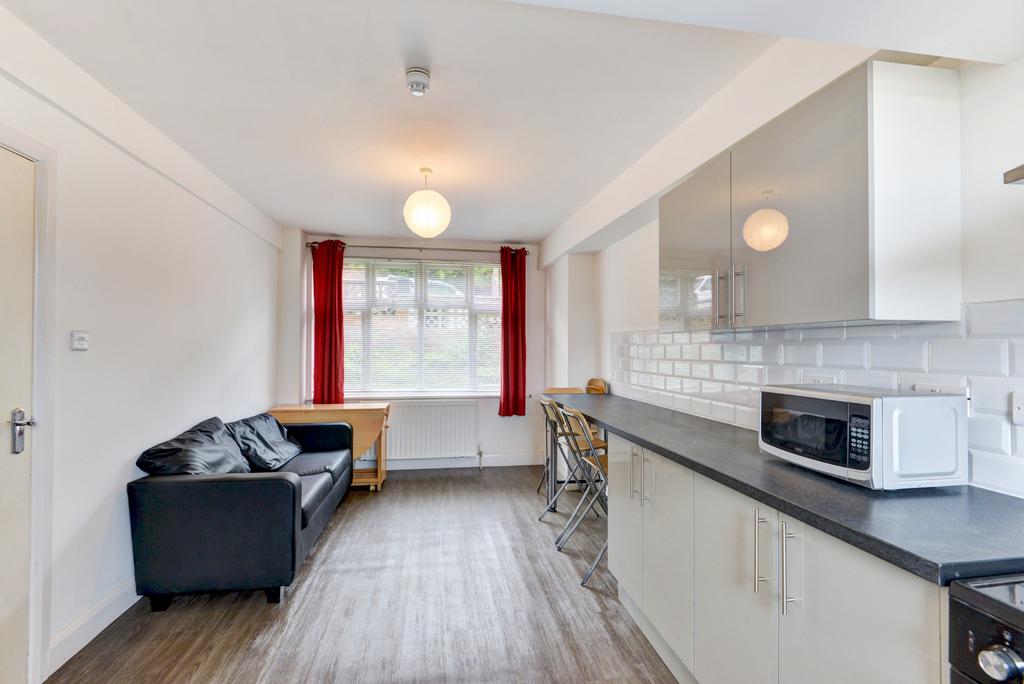 Bright open-plan living area with a cosy seatin...