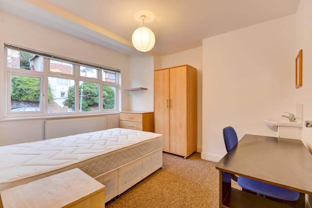 Bright double bedroom with a large front-facing...