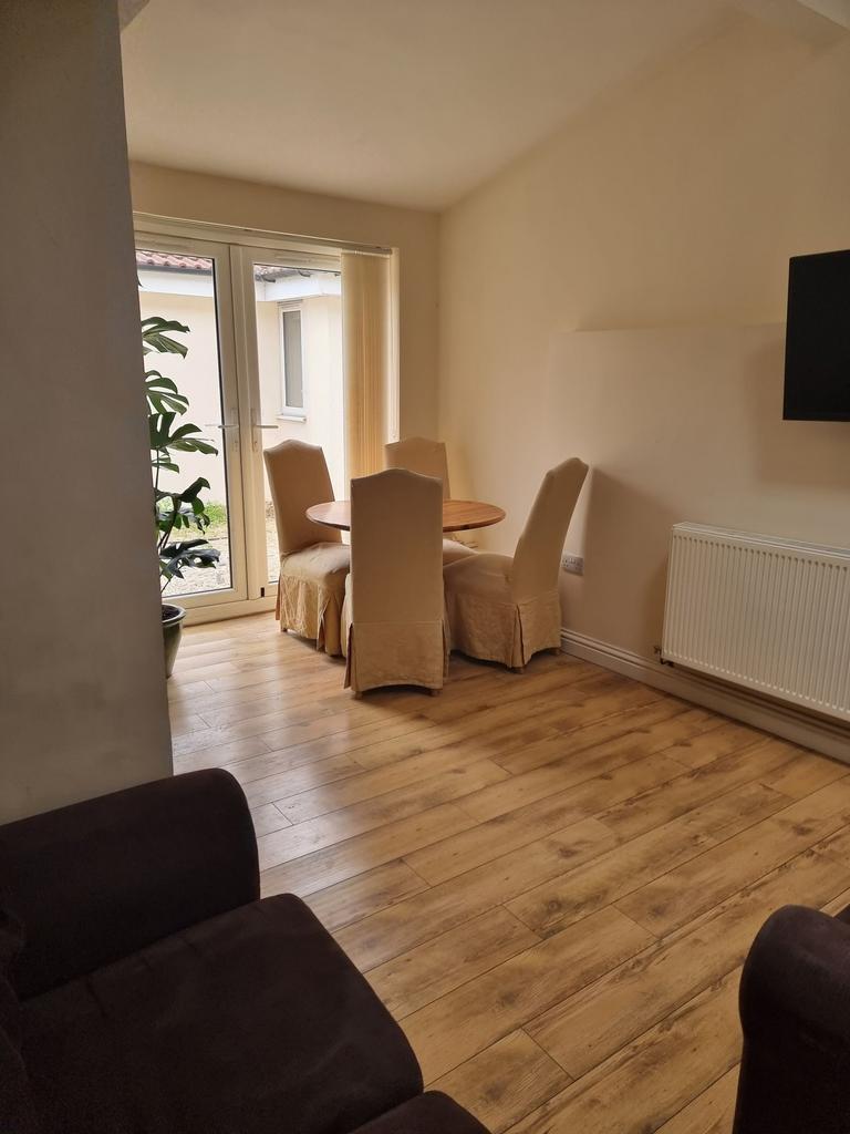 Bright, well-presented reception area with wood...