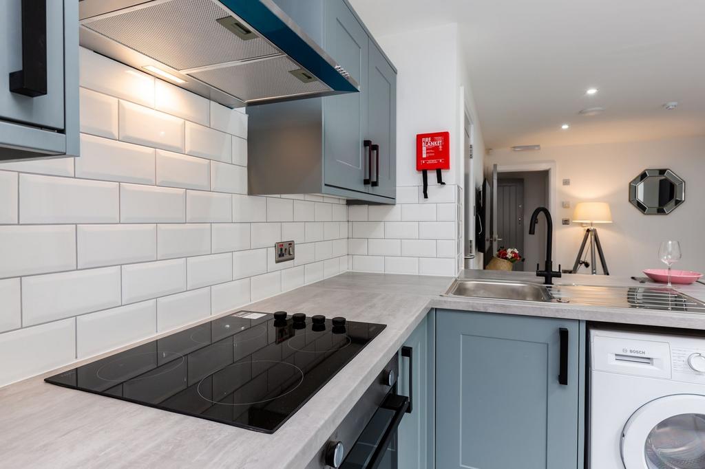 Modern galley kitchen with fitted units, sleek ...