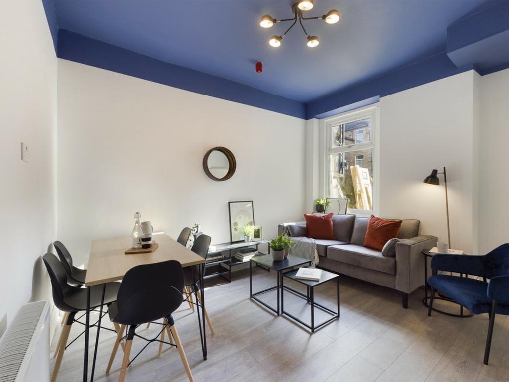 A bright and inviting large modern living room,...