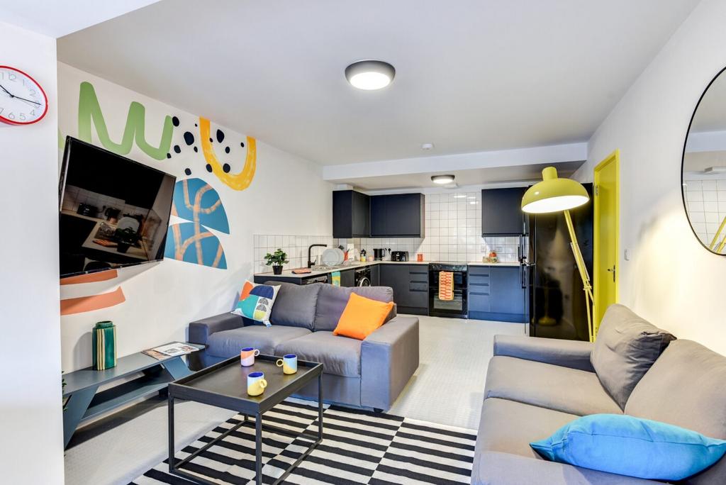 Bright, modern open-plan living room with a com...